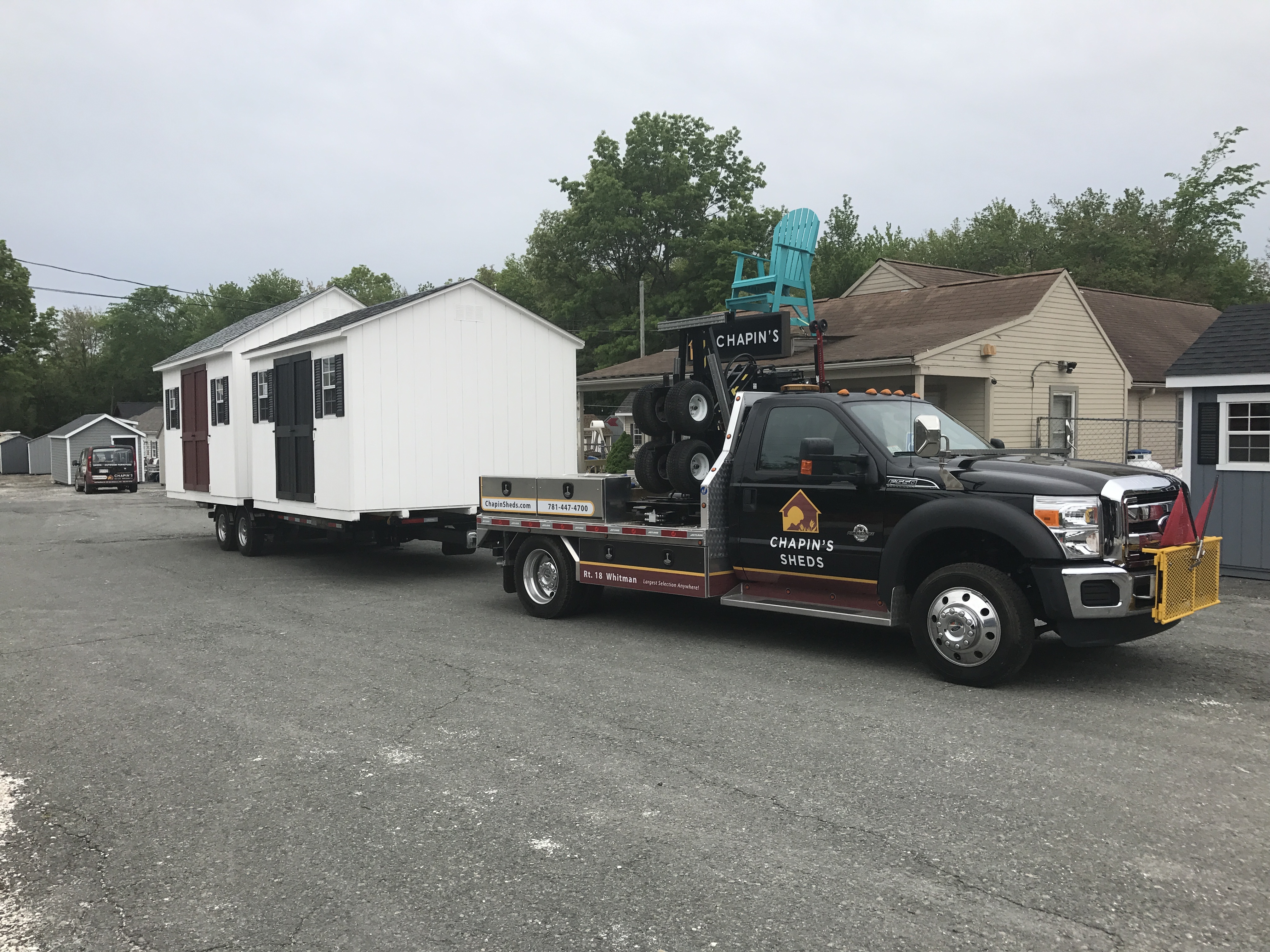 Truck Pulling a Pre-Built Shed